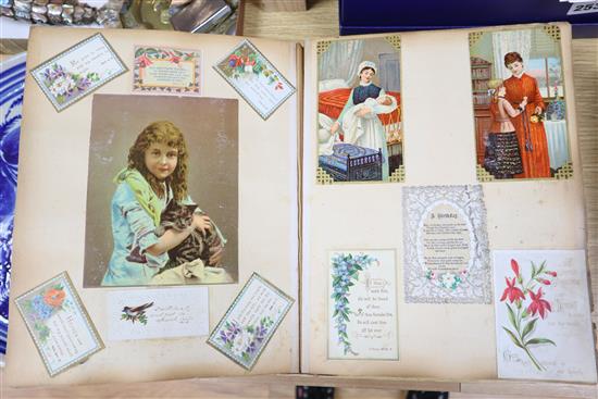A photograph album and an album of 19th century and later greetings cards and postcards